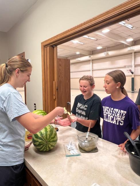 1 1 Slathering up for the Watermelon Relay